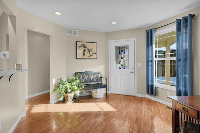 entrance foyer with recessed lighting, visible vents, baseboards, and hardwood / wood-style flooring