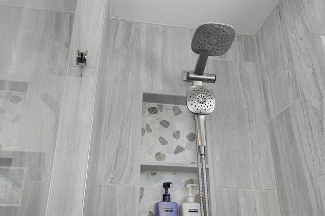 room details with a tile shower