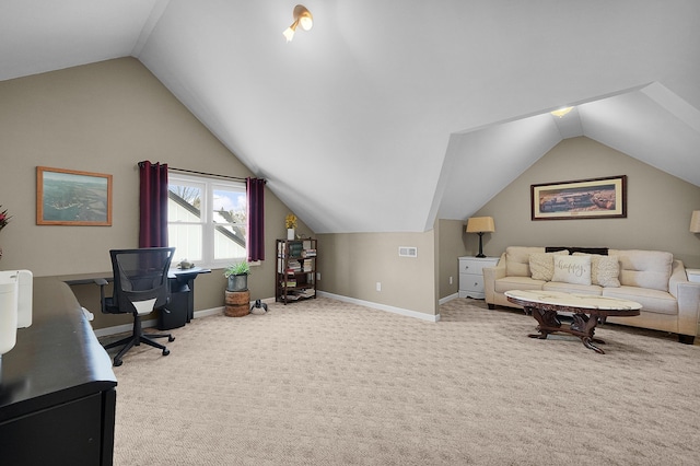 office with visible vents, baseboards, lofted ceiling, and carpet floors