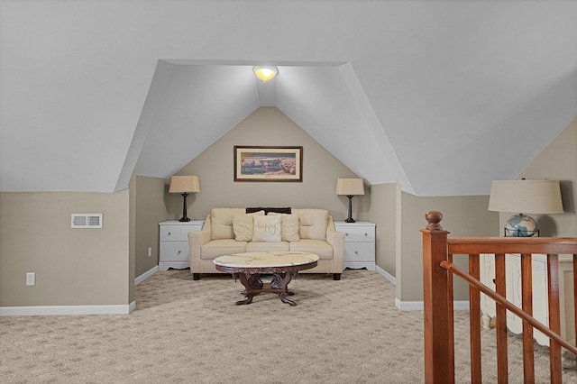 carpeted bedroom featuring visible vents, baseboards, and vaulted ceiling