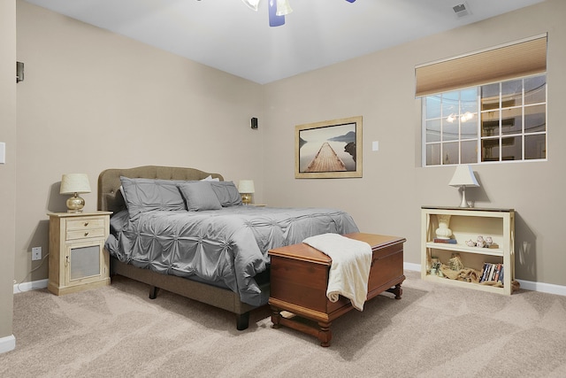 bedroom featuring carpet flooring, visible vents, baseboards, and ceiling fan