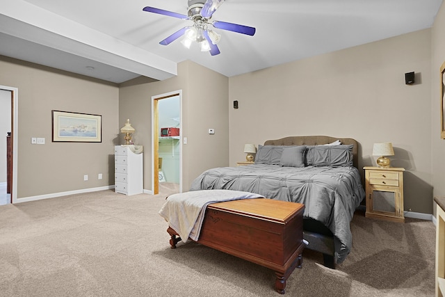 carpeted bedroom with ceiling fan and baseboards