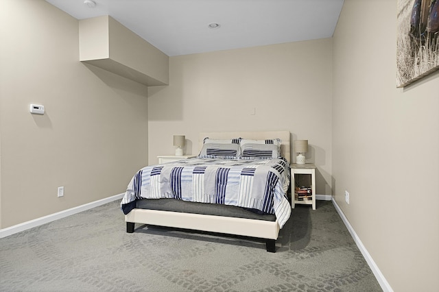 bedroom with carpet flooring and baseboards