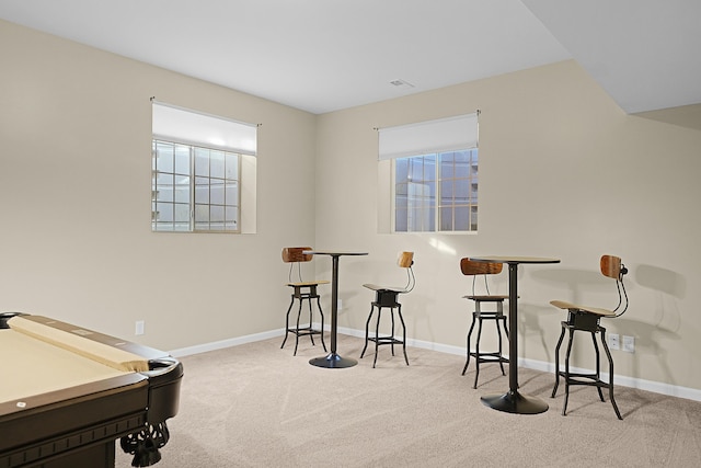 recreation room featuring carpet flooring and baseboards