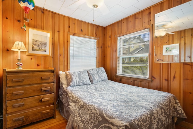 36.5 Lake Shore Dr, South Haven, MI 49090 - bedroom featuring wood finished floors and wooden walls