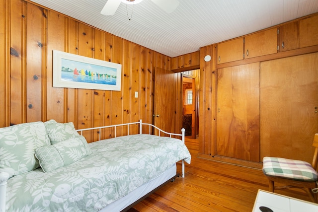 36.5 Lake Shore Dr, South Haven, MI 49090 - bedroom with ceiling fan, wood finished floors, and wood walls