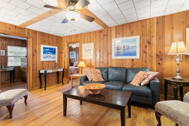36.5 Lake Shore Dr, South Haven, MI 49090 - living area featuring wood finished floors, a ceiling fan, and wood walls