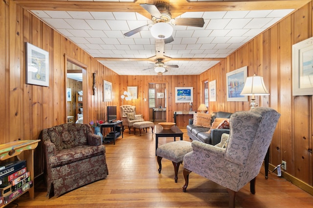 36.5 Lake Shore Dr, South Haven, MI 49090 - living area featuring wood finished floors, wooden walls, and ceiling fan