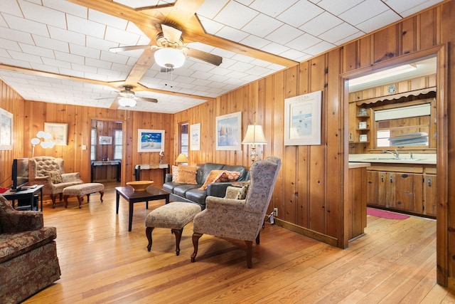 36.5 Lake Shore Dr, South Haven, MI 49090 - living room featuring light wood-style floors, ceiling fan, and wood walls