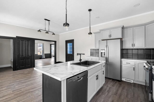 816 7th St, Three Rivers, MI 49093 - kitchen featuring a sink, gas range oven, stainless steel fridge, light countertops, and dishwasher