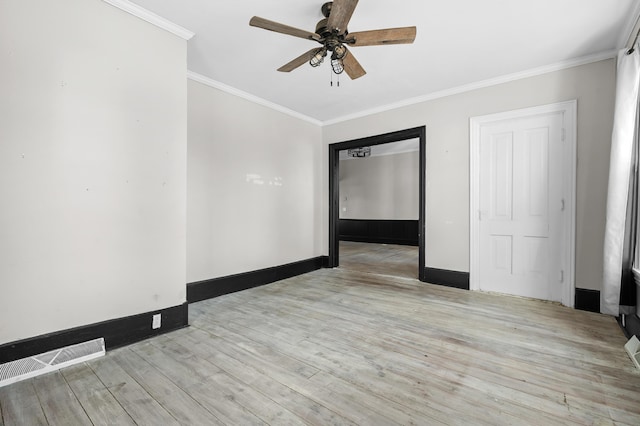 816 7th St, Three Rivers, MI 49093 - spare room with wood finished floors, baseboards, a ceiling fan, visible vents, and ornamental molding