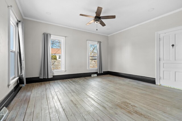 816 7th St, Three Rivers, MI 49093 - spare room with visible vents, crown molding, baseboards, ceiling fan, and light wood-type flooring