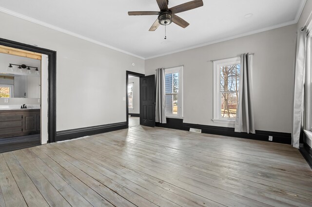 816 7th St, Three Rivers, MI 49093 - interior space featuring baseboards, visible vents, ceiling fan, wood-type flooring, and crown molding