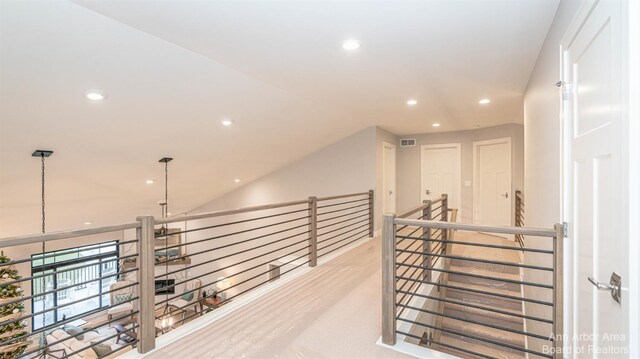 1303 Gallery Pointe Dr, Saline, MI 48176 - hallway featuring recessed lighting, visible vents, lofted ceiling, and wood finished floors