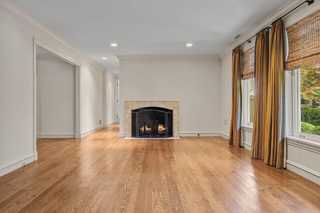 5716 E 1000 N, La Porte, IN 46350 - unfurnished living room with a premium fireplace, recessed lighting, light wood-type flooring, ornamental molding, and visible vents