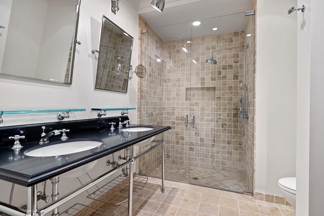 5716 E 1000 N, La Porte, IN 46350 - bathroom with a sink, toilet, tile patterned flooring, and a shower stall