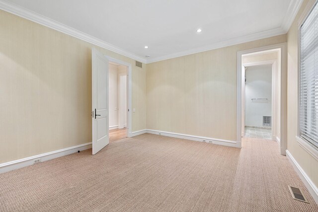 5716 E 1000 N, La Porte, IN 46350 - spare room with crown molding, light colored carpet, and visible vents