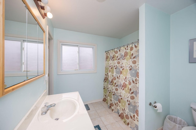 bathroom with tile patterned flooring, vanity, a shower with curtain, and toilet