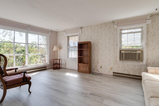 5844 S Scottdale Rd, Berrien Springs, MI 49103 - sitting room with cooling unit, wallpapered walls, wood finished floors, and a baseboard radiator
