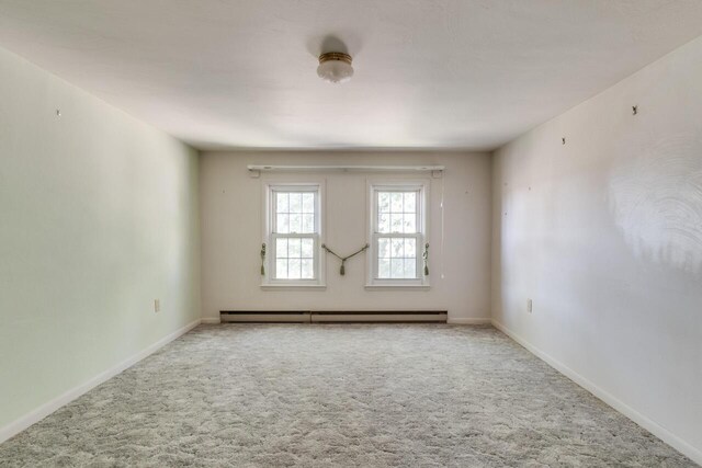 5844 S Scottdale Rd, Berrien Springs, MI 49103 - carpeted spare room with a baseboard radiator and baseboards
