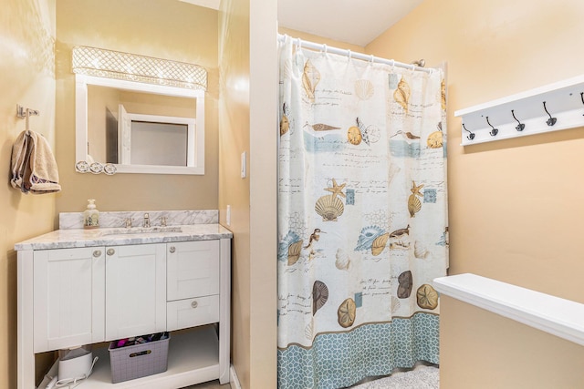 full bath with a shower with shower curtain and vanity