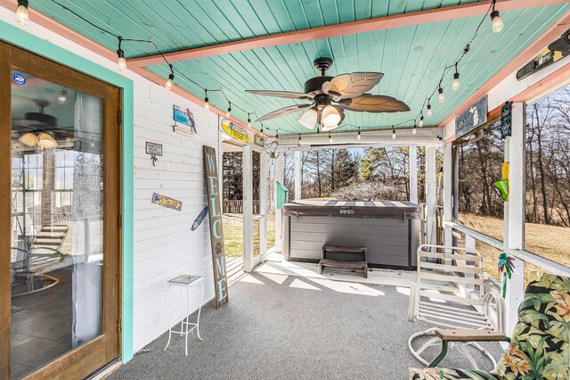 view of patio / terrace featuring a hot tub and ceiling fan