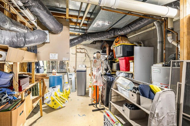 unfinished basement featuring concrete block wall