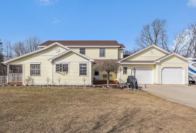view of front facade featuring a front yard, driveway, and an attached garage