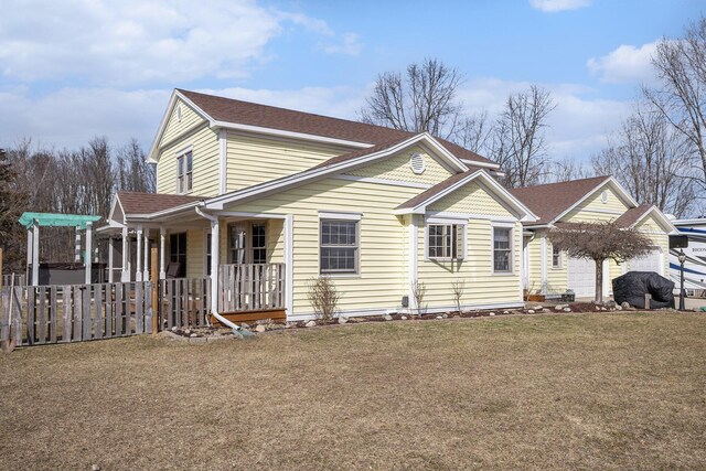 exterior space featuring a front yard and fence