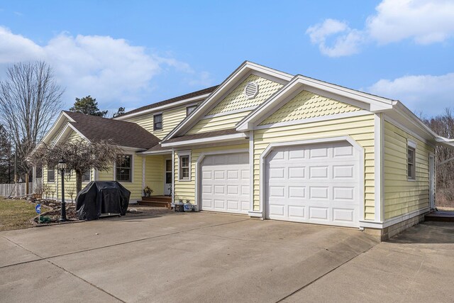 view of front of property featuring driveway and a garage