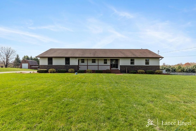 single story home featuring a porch, brick siding, and a front yard