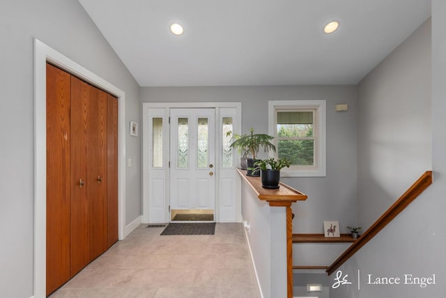 entrance foyer with light tile patterned flooring, baseboards, recessed lighting, and visible vents