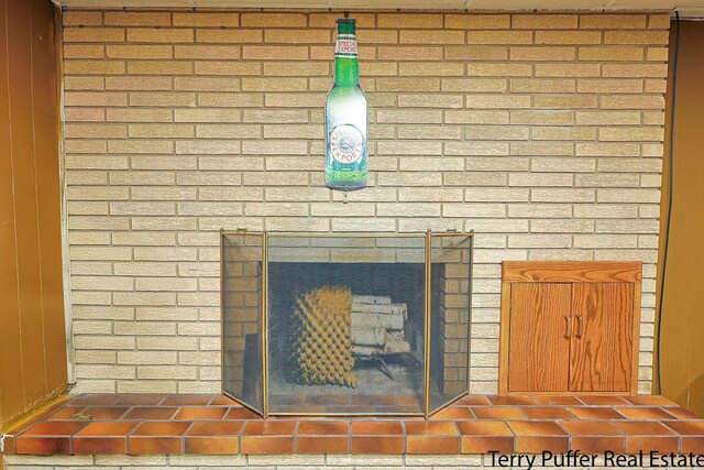 details with a brick fireplace