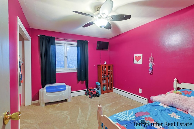 bedroom featuring carpet, a ceiling fan, a baseboard heating unit, baseboards, and a baseboard radiator