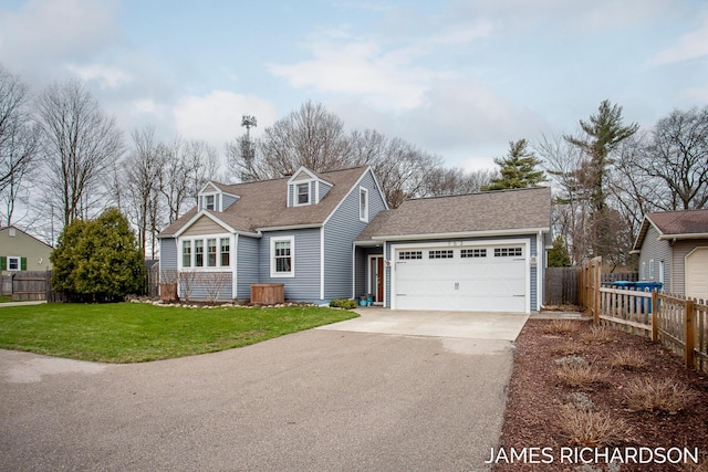 cape cod-style house with aphalt driveway, fence, roof with shingles, a front yard, and a garage