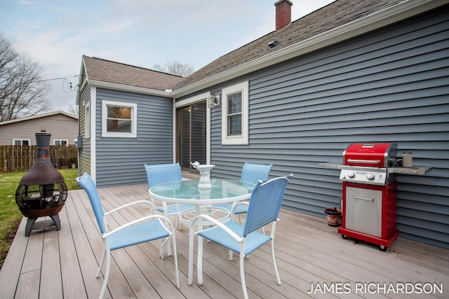 deck featuring fence and outdoor dining space