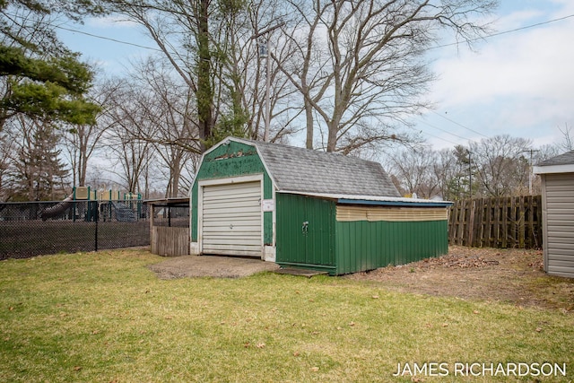 view of shed featuring fence