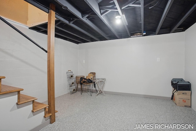 finished below grade area featuring stairway