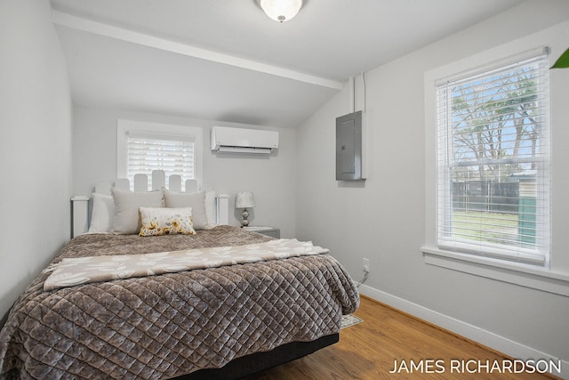 bedroom featuring a wall mounted air conditioner, wood finished floors, electric panel, baseboards, and lofted ceiling