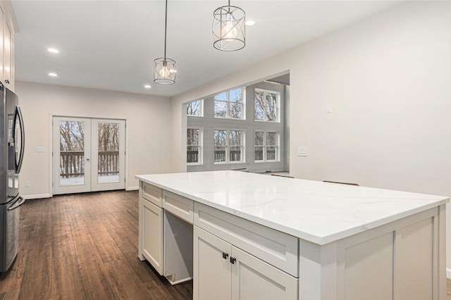 62711 Balk Rd, Sturgis, MI 49091 - kitchen with freestanding refrigerator, dark wood-style flooring, a kitchen island, recessed lighting, and pendant lighting