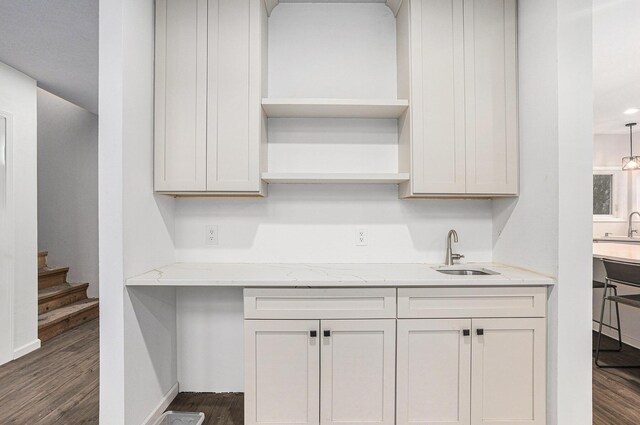 62711 Balk Rd, Sturgis, MI 49091 - kitchen featuring a sink, open shelves, dark wood-style floors, and light stone countertops