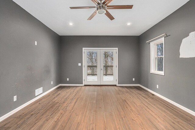 62711 Balk Rd, Sturgis, MI 49091 - unfurnished room featuring wood finished floors, a ceiling fan, french doors, baseboards, and recessed lighting