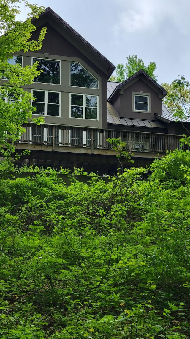 62711 Balk Rd, Sturgis, MI 49091 - rear view of house with metal roof, a standing seam roof, and stucco siding