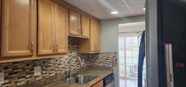 889 Kirts Blvd, Troy, MI 48084 - kitchen featuring decorative backsplash, stainless steel dishwasher, a sink, dark countertops, and a paneled ceiling