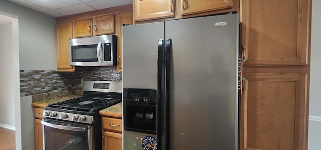 889 Kirts Blvd, Troy, MI 48084 - kitchen featuring stainless steel appliances, a paneled ceiling, and tasteful backsplash