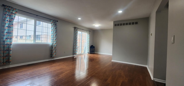 889 Kirts Blvd, Troy, MI 48084 - empty room featuring wood finished floors, recessed lighting, baseboards, and visible vents