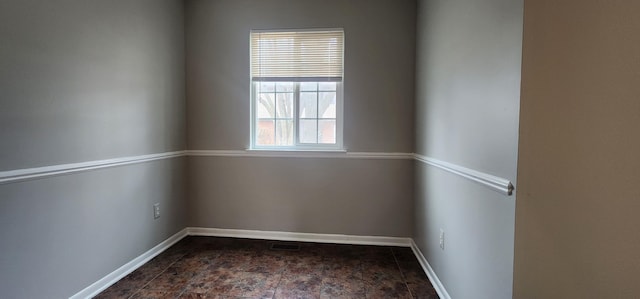 889 Kirts Blvd, Troy, MI 48084 - spare room featuring stone finish floor and baseboards