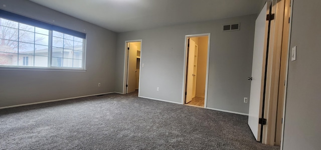 889 Kirts Blvd, Troy, MI 48084 - unfurnished bedroom featuring baseboards, visible vents, and carpet flooring