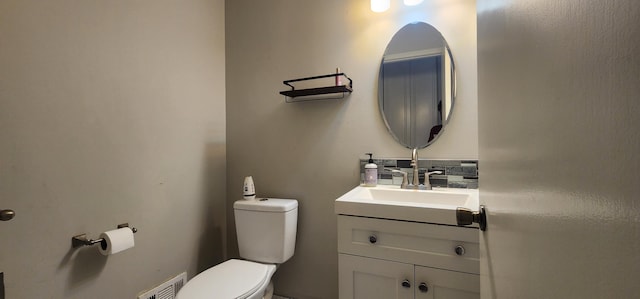 889 Kirts Blvd, Troy, MI 48084 - bathroom featuring toilet, vanity, and visible vents