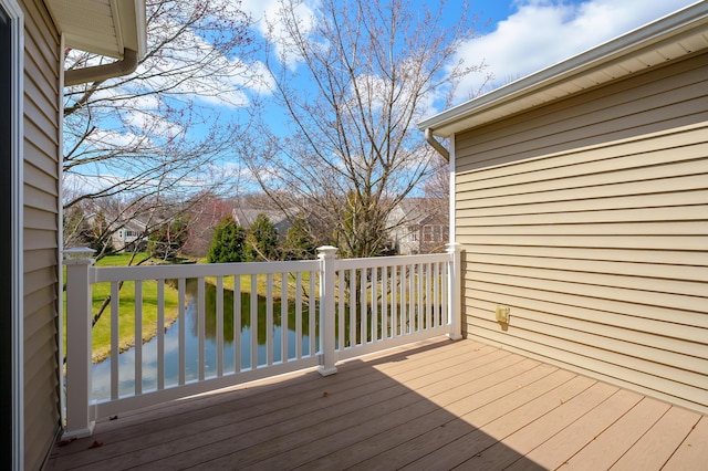 wooden deck with a yard
